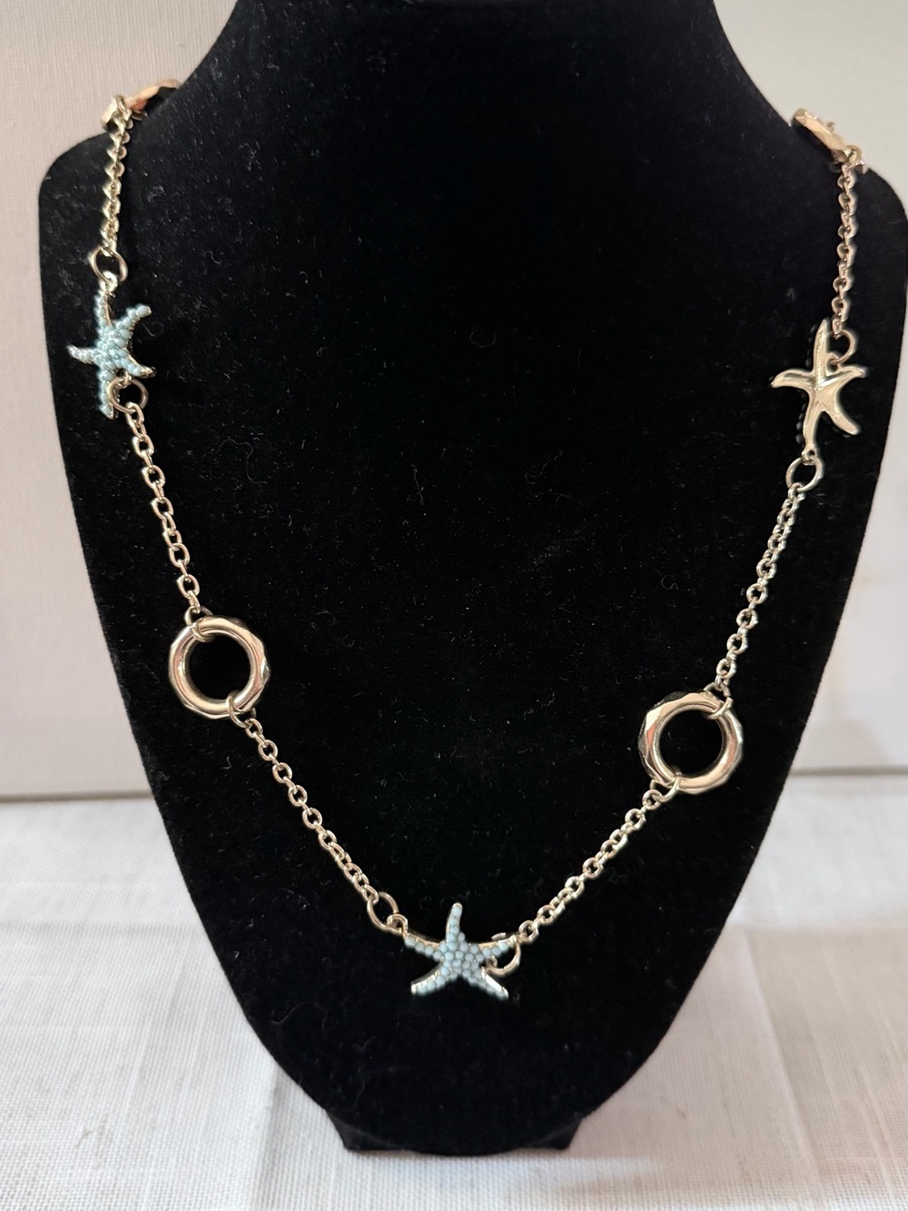 Gold Starfish Link Necklace with Pale Blue Accents